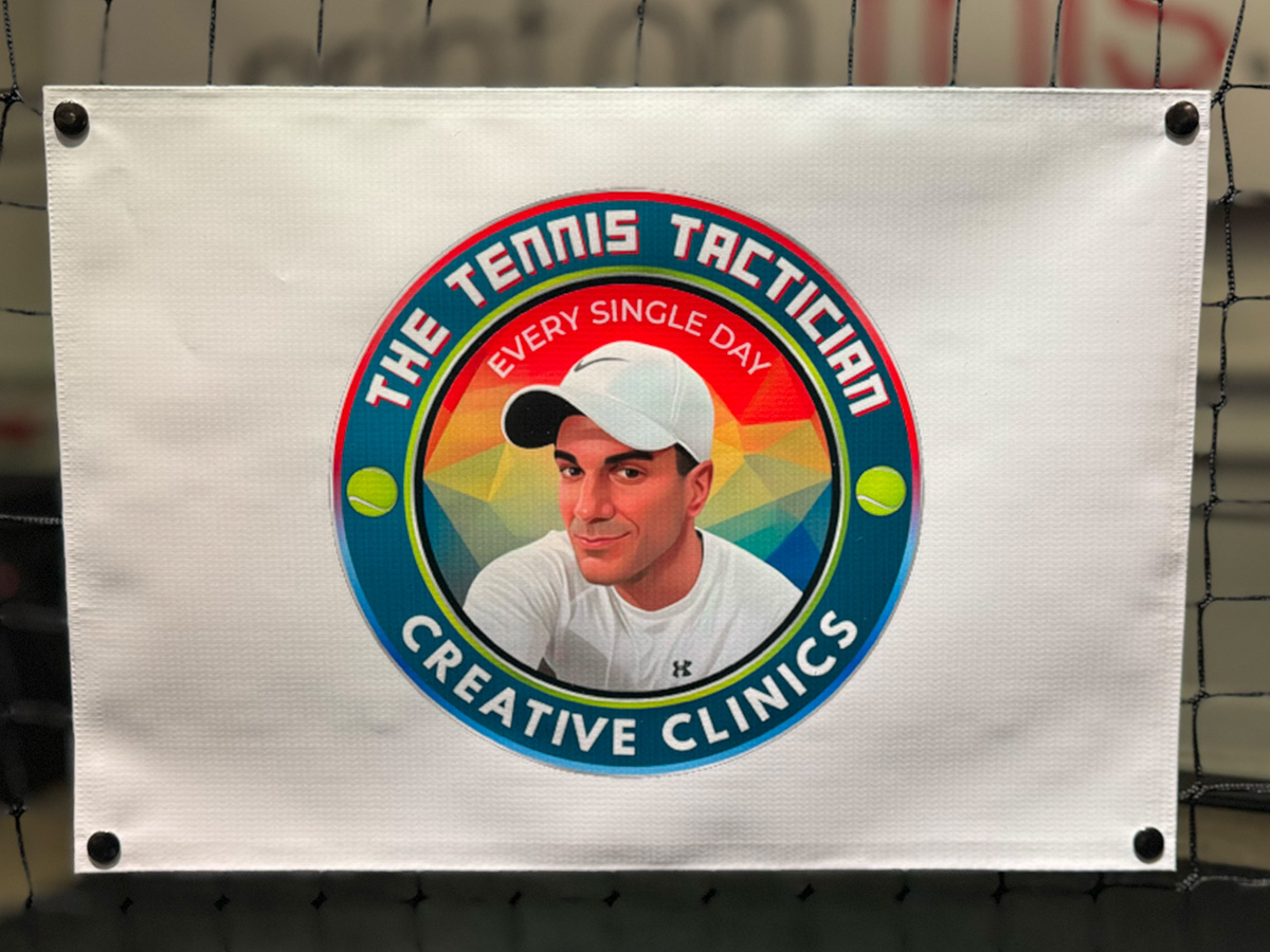 Tennis Tactician branded NetSnaps net banner on a practice court